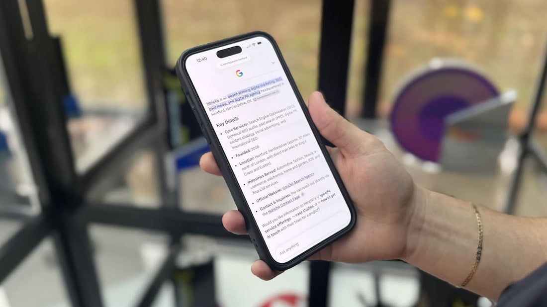 A phone showing Google's AI answer describing Honchō as an award-winning digital marketing, SEO, paid media and digital PR agency