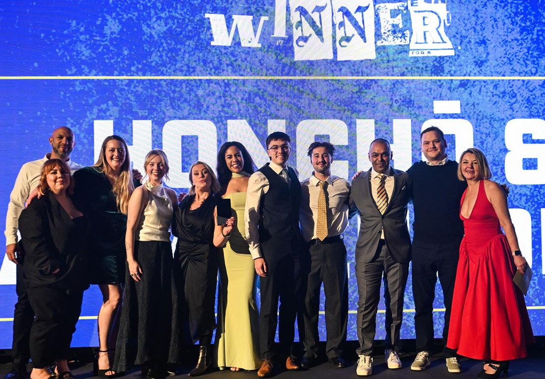 Honcho team accepting an award